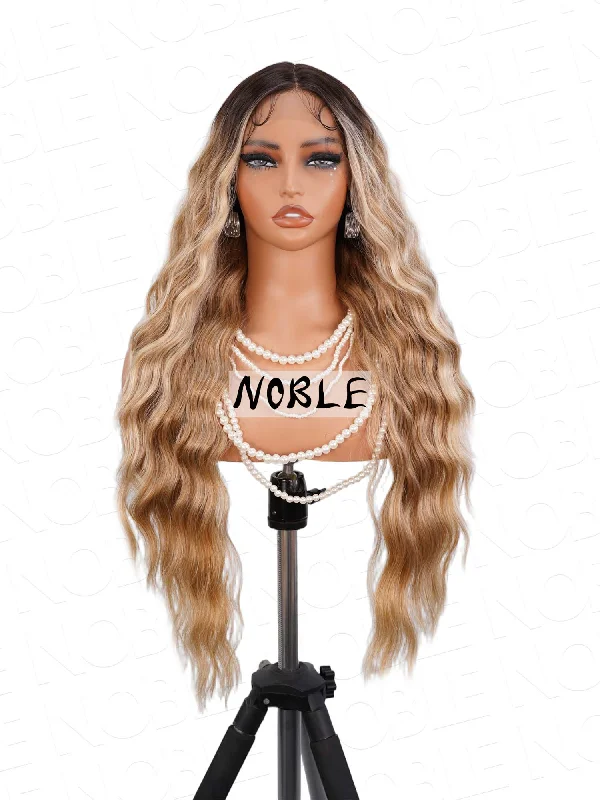 Noble Ombre Mixed Blonde Body Wave T-Part Lace Realistic Synthetic Hair 13×4×1 Lace Pre Plucked Wig 27 Inch Noble Ombre Mixed Blonde Body Wave T-Part Lace Realistic Synthetic Hair 13×4×1 Lace Pre Plucked Wig 27 Inch
